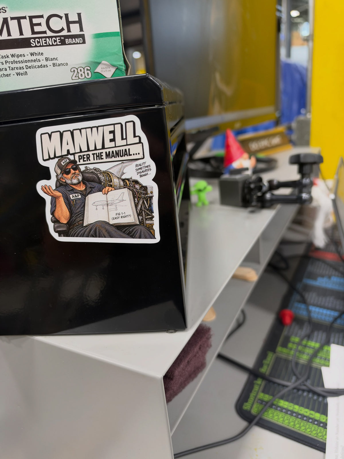 Manwell — Per the Manual Sticker